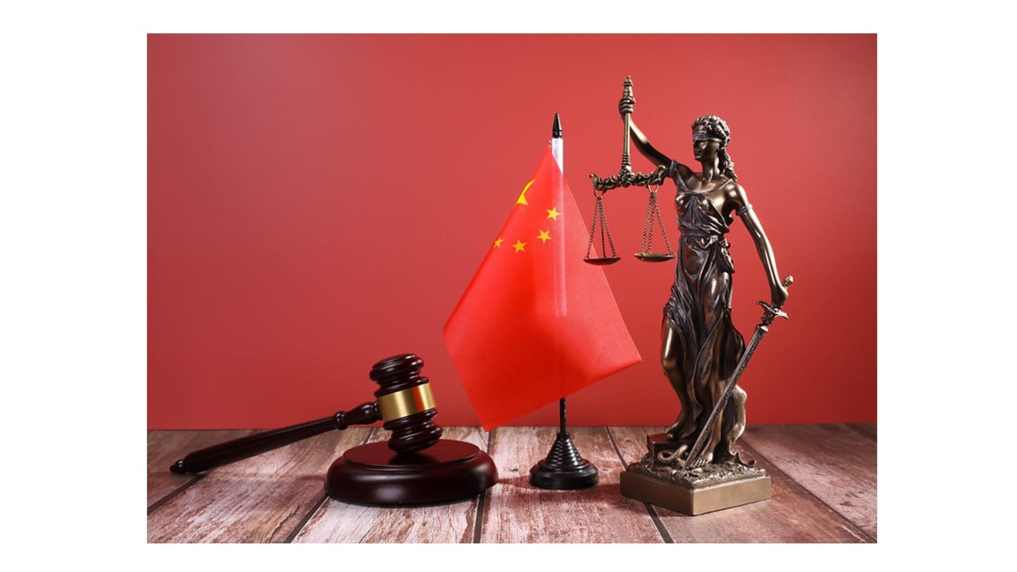 Image of a statue of Lady Justice, a judge’s gavel and a flag of China by Marco Verch on https://flic.kr/p/2n4XvCZ (CC BY 2.0) https://creativecommons.org/licenses/by/2.0/