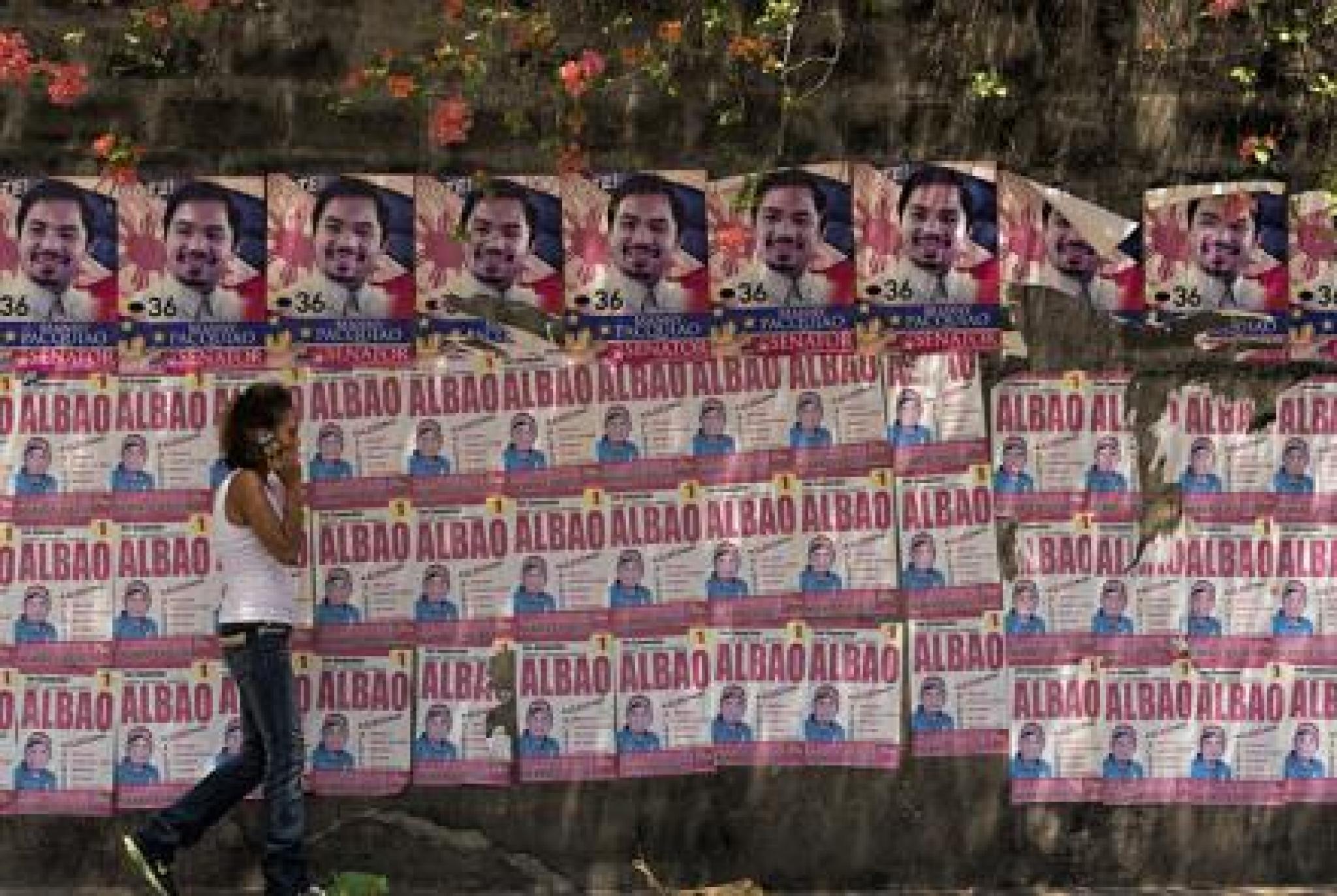 Wall plastered with election material, ahead of the Philippine local and National Election on the 9th May. Bacolod City, Philippines. Image by Brian Evans on Flickr under the CC BY-NC-ND 2.0 license.