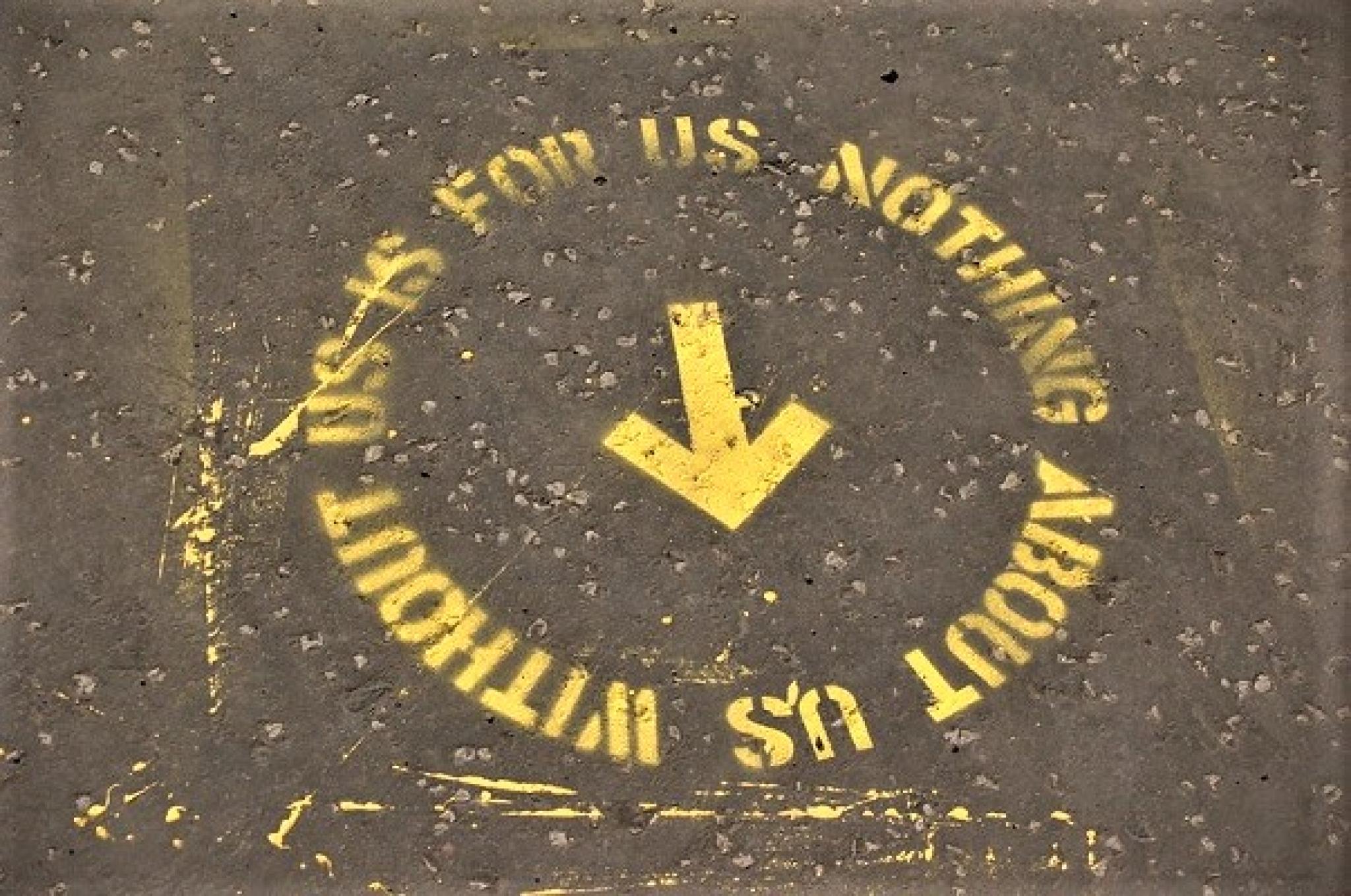 Image of street art stencil: “Nothing about us without us is for us” from public art event of the same name in Glasgow, Scotland, by t s Beall and many others from https://flic.kr/p/dv5FgK, used under CC BY-NC-SA 2.0 DEED licence