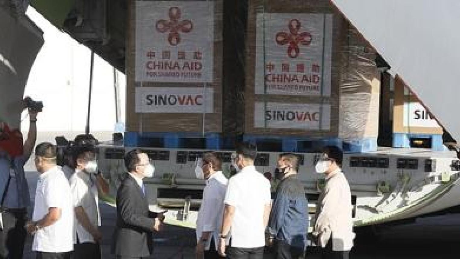 Image of President Rodrigo Duterte and Ambassador Huan Xilian at arrival of 600,000 doses of Sinovac vaccines at Villamor Air Base (Feb. 28, 2021); PNA photo by Avito C. Dalan, Public domain, via Wikimedia Commons