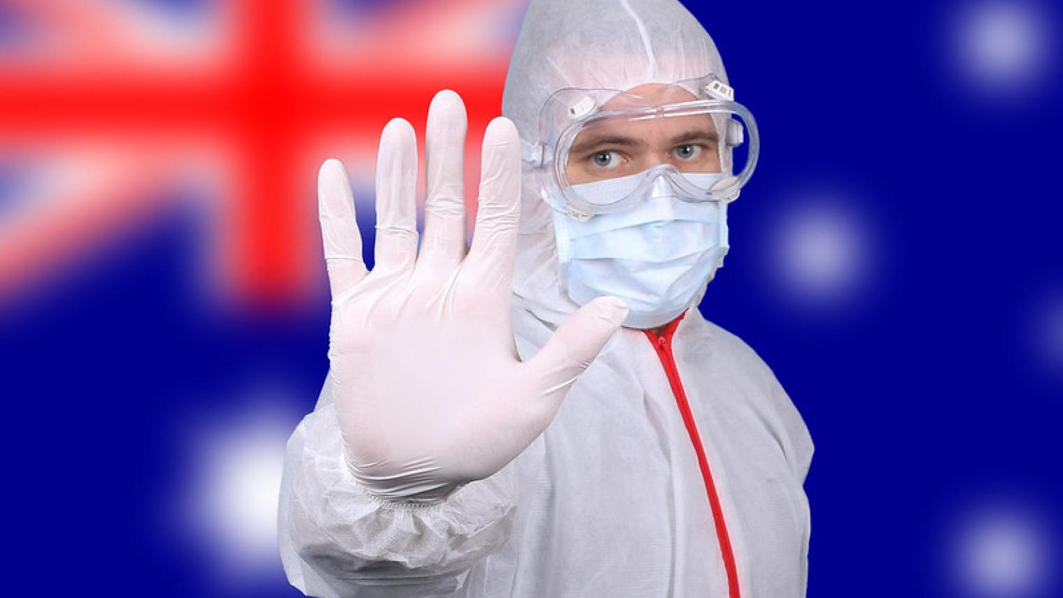 Worker in PPE with Australian flag background by Jernej Furman at https://flic.kr/p/2iNQNsV (CC BY 2.0)