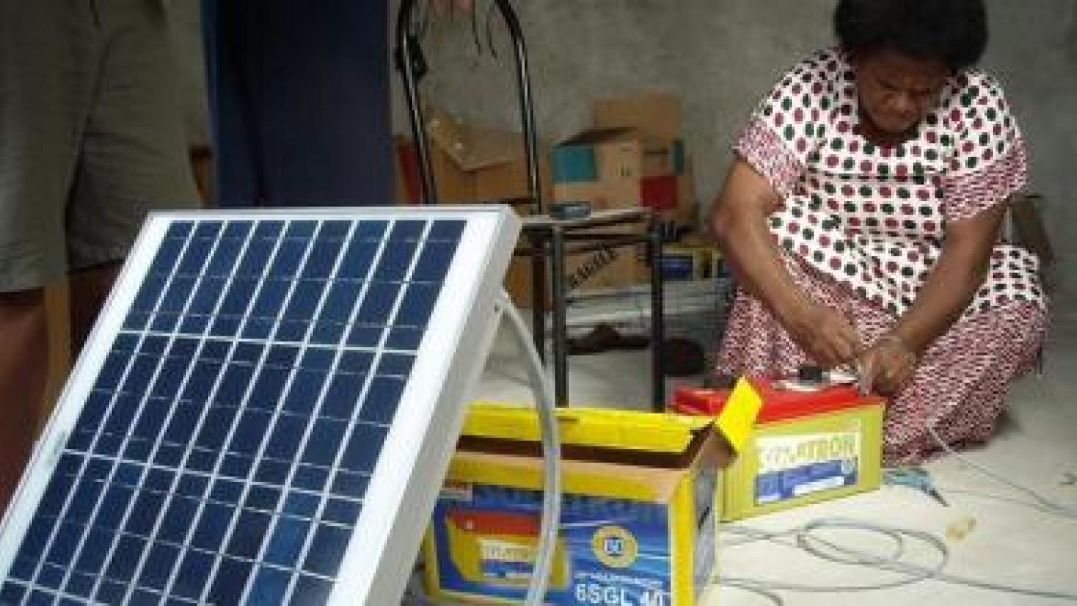Image of Barefoot College woman graduate installing solar panels in Kadavu, Fiji. Photo by Laura Cleary from UN Women Pacific flickr account. https://flic.kr/p/nnM9m2  (CC BY-SA 2.0) https://creativecommons.org/licenses/by-sa/2.0/ 
