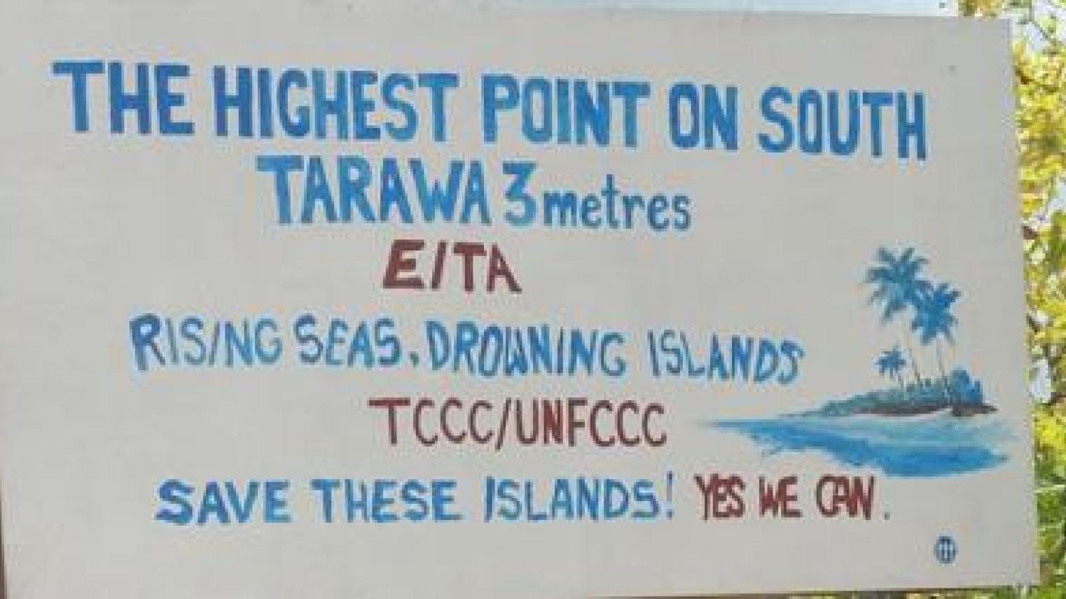 Image credit: Image of a sign on South Tarawa, Kiribati, warning of the threat of sea level rise to the island, with its highest point being 3 metres above sea level, from Wikipedia Commons, (CC BY 2.0).