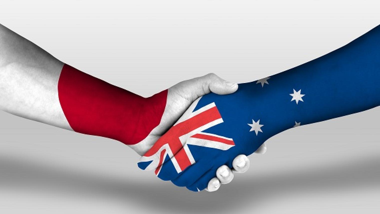 Image of handshake with Australian and Japanese flags painted on each hand, by prehistorik, used under Adobe Education license.