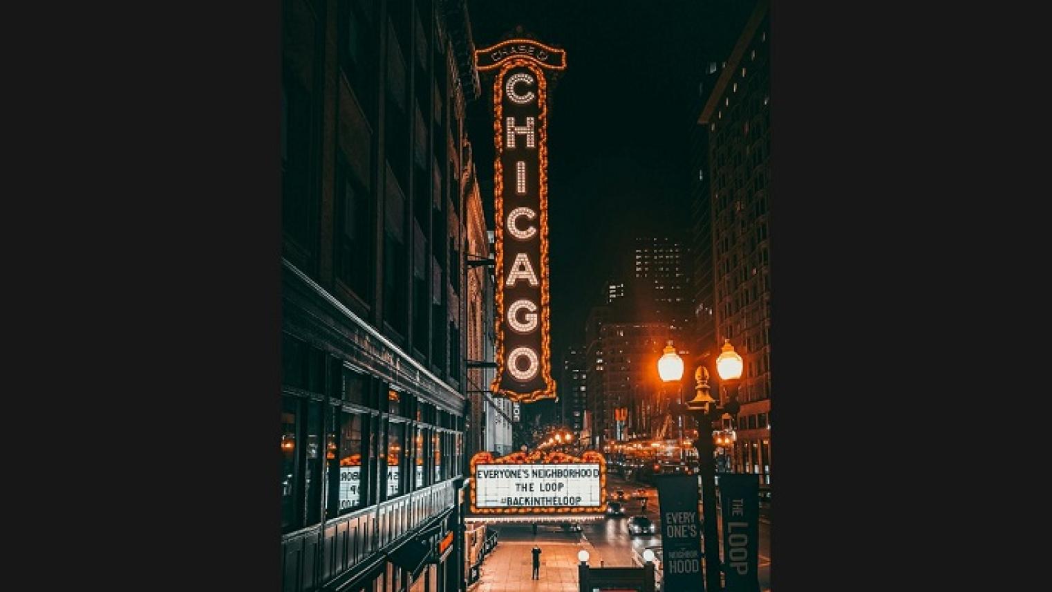 Photo of Chicago Theater lit up at night by Jona, from pexels, free to use under Pexels licence.