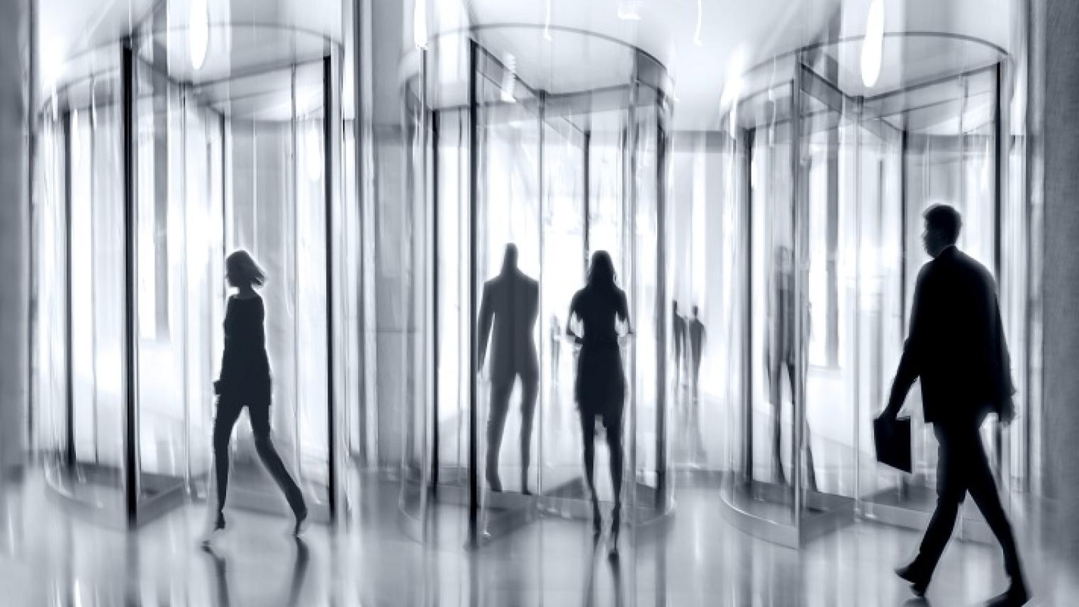 Artistically blurry illustration of human figures walking in and out of 3 revolving doors, by bluraz, from Adobe Stock, used under Educational Licence.