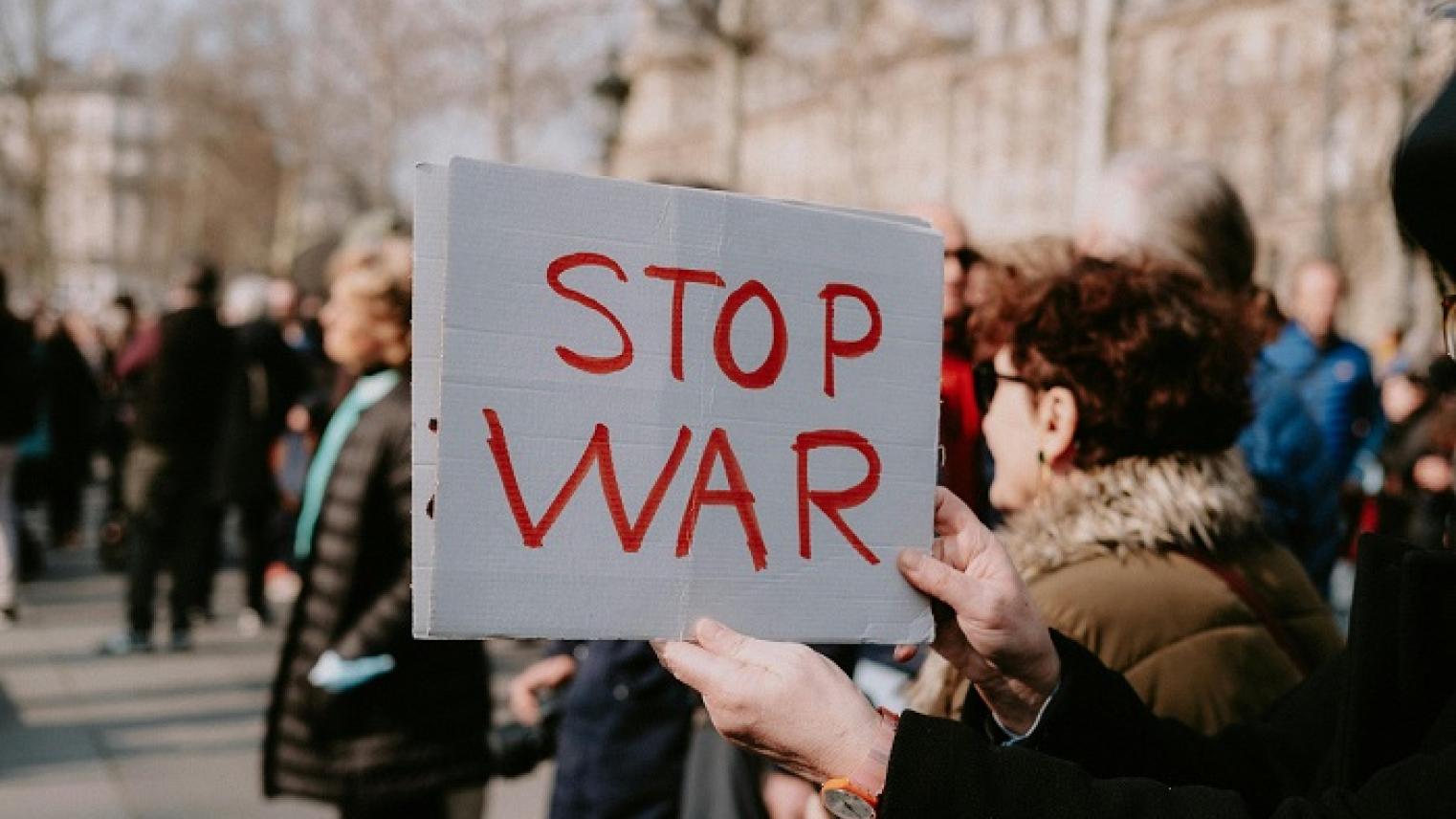 Image of ‘No War’ sign at a protest, by Mathias Reding, from pexels.com, free to use.